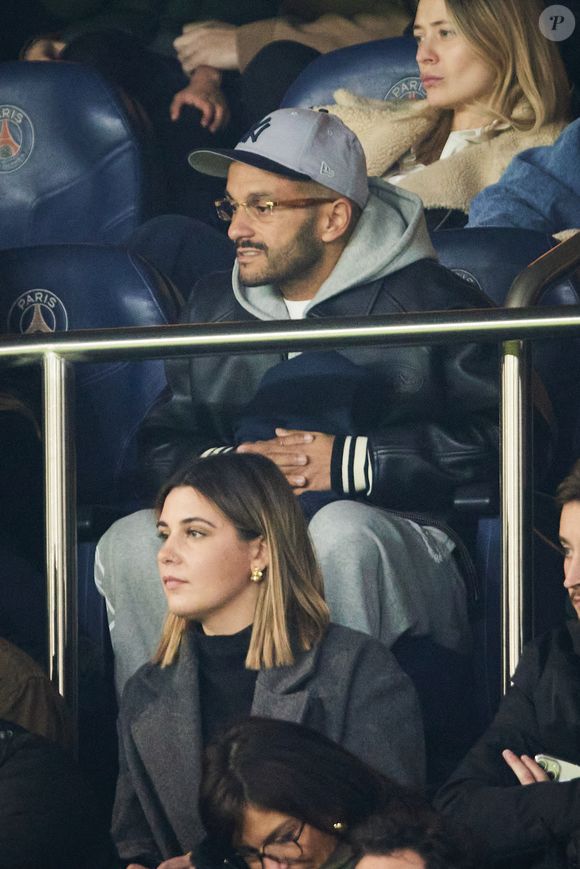 Malik Bentalha - Célébrités dans les tribunes lors du match de Ligue 1 McDonald's opposant le Paris Saint-Germain (PSG) à l'Olympique de Marseille (OM) - (3-1) au Parc des Princes à Paris le 16 mars 2025. © Cyril Moreau/Bestimage