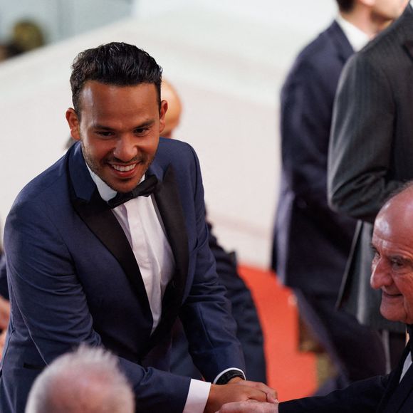 "J’ai un peu moins de temps pour voir mes amis et ma famille, mais, en tant qu’enfant de la télé, je vis un rêve", a poursuivi Mohamed Bouhafsi, qui semble donc très bien vivre cette nouvelle vie.

Mohamed Bouhafsi assiste à la projection de "November (Novembre)" lors de la 75ème édition du festival de Cannes au Palais des Festivals le 22 mai 2022 à Cannes, France. Photo by David Boyer/ABACAPRESS.COM