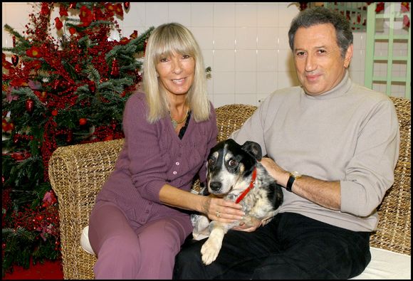 Michel Drucker et Dany Saval.  avec leur nouveau chien TOMMY adoptÈ par MICHEL DRUCKER lors du Noel des animaux de la S.P.A au palais des sports Marcel Cerdan. Guillaume Gaffiot/Bestimage