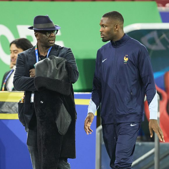 Une jeune américaine affirme que le fils de Lilian Thuram l’a attaqué alors qu’ils se trouvaient chez elle

Lilian Thuram avec son fils Marcus Thuram - Célébrités dans les tribunes du match du groupe D de l'Euro 2024 entre l'équipe de France face à l'Autriche (1-0) à Dusseldorf en Allemagne le 17 juin 2024. © Cyril Moreau/Bestimage