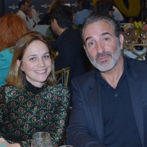 Jean Dujardin traverse une période difficile après la perte de Bruno Salomone. 
Jean Dujardin et sa femme Nathalie Péchalat lors du Dîner de charité Breitling à la Samaritaine pour l'association "Premiers de Cordée" à Paris.  Rachid Bellak/Bestimage