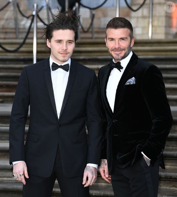 David Beckham et son fils Brooklyn à la première de la série Netflix "Our Planet" au Musée d'Histoires Naturelles à Londres, le 4 avril 2019. Backgrid UK/ Bestimage