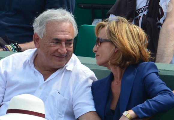 Dominique Strauss-Kahn et sa compagne Myriam L'Aouffir assistent à la finale féminine Serena Williams vs Maria Sharapova lors des Internationaux de France de Tennis 2013 au stade Roland-Garros à Paris, France le 8 juin 2013. Williams a gagné 6-4, 6-4. Photo Christophe Guibbaud/ABACAPRESS.COM