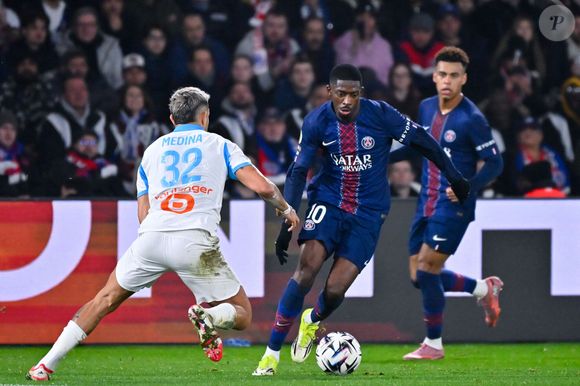 Ousmane Dembele et Facundo Medina lors du match de Ligue 1 entre le Paris Saint Germain et l'Olympique de Marseille au Parc Des Princes le 08 février 2026 à Paris, France.  © Federico Pestelini / PsnewZ / Bestimage