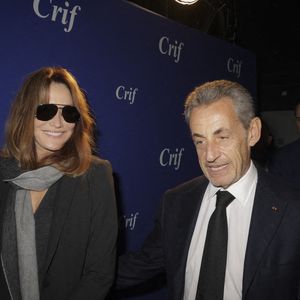 Nicolas Sarkozy et Carla Bruni Sarkozy lors d'une cérémonie organisée par le Conseil des institutions juives de France (CRIF) en hommage aux victimes des attentats du Hamas du 7 octobre 2023 contre Israël, à l'occasion du premier anniversaire de l'événement, à Paris, le 7 octobre 2024. 

© Jack Tribeca / Bestimage