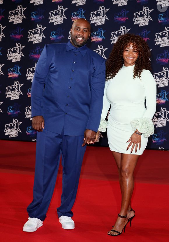 Teddy Riner et sa compagne Luthna Plocus au photocall de la 27ème édition des NRJ Music Awards au palais des Festivals de Cannes, France, le 31 octobre 2025. 

© Dominique Jacovides/Bestimage