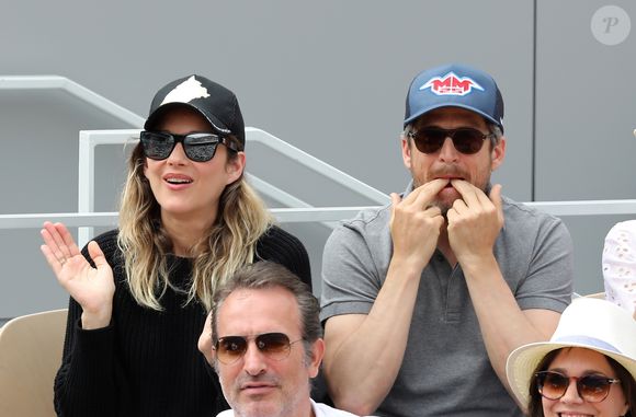 Marion Cotillard et Guillaume Canet - People dans les tribunes lors de la finale messieurs des internationaux de France de tennis de Roland Garros 2019 à Paris le 9 juin 2019. © Jacovides-Moreau/Bestimage