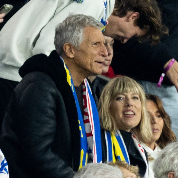 Nagui souhaite porter plainte contre le membre de l'UDR.

Célébrités dans les tribunes du match de qualification de la Coupe du monde 2026 entre la France contre l'Ukraine (4-0) au Parc des Princes à Paris le 13 novembre 2025. © Cyril Moreau/Bestimage