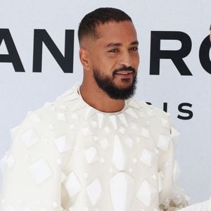 Avant cela, il s'était déjà illustré au festival Mawazine au Maroc, où il avait dévoilé un nouveau titre.

Slimane  - Arrivées au défilé "Stéphane Rolland", Collection Haute Couture Automne/Hiver lors de la Fashion Week de Paris (PFW). © Denis Guignebourg/Bestimage