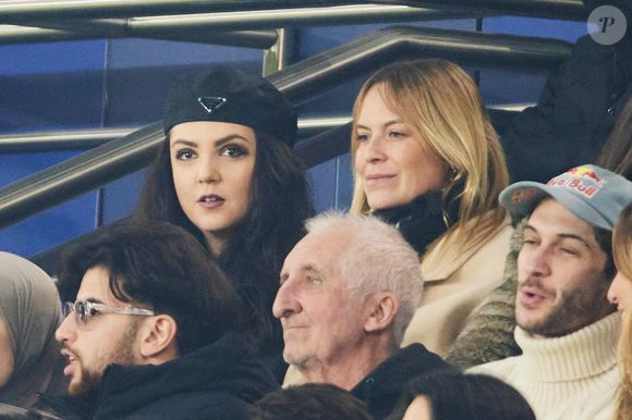 Just Riahd, Hoshi dans les tribunes lors du match de Ligue Des Champions 2024-2025 (LDC) "PSG - Brest (7-0)" au Parc Des Princes, le 19 février 2025.
© Cyril Moreau/Bestimage