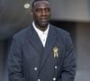Sur le cliché officiel, la star prend la pose dans un élégant trench-coat en cuir noir, la main posée sur le cœur.

Omar Sy lors du photocall du dîner "Prelude pour les JO" à la Fondation Vuitton à Paris, France, le 25 juillet 2024.

© Olivier Borde/Bestimage