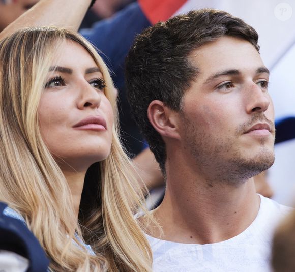 Dylan Deschamps et sa compagne Mathilde Cappelaere - Célébrités dans les tribunes du match du groupe D de l'Euro 2024 entre l'équipe de France face à l'Autriche (1-0) à Dusseldorf en Allemagne le 17 juin 2024. © Cyril Moreau/Bestimage