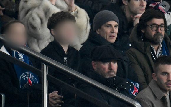 Guillaume Canet et son fils Marcel dans les tribunes du match de Ligue des Champions entre le Paris Saint-Germain et Newcastle au Parc des Princes à Paris le 28 janvier 2026. 

© Lionel Urman/PsnewZ/Bestimage