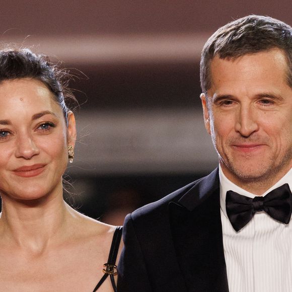 Marion Cotillard et Guillaume Canet - Descente des marches du film " Karma " lors du 79ème Festival International du Film de Cannes, le 15 mai 2026. © Jacovides-Moreau / Bestimage