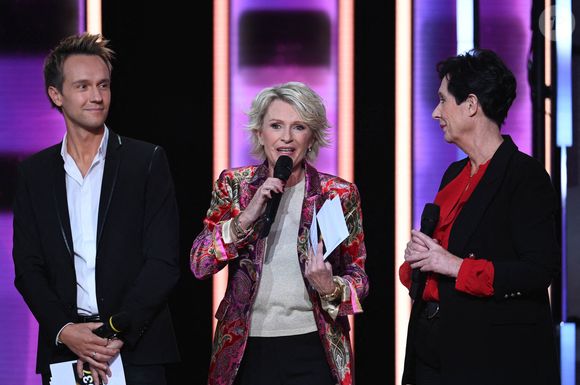 Cyril Feraud, animateur de télévision français, Sophie Davant, journaliste et animatrice radio et TV et Laurence Tiennot-Herment, présidente de l'AFM lors du Téléthon 2023, à Saint Denis, près de Paris, France le 8 décembre 2023 Photo par Tomas Stevens/ABACAPRESS.COM