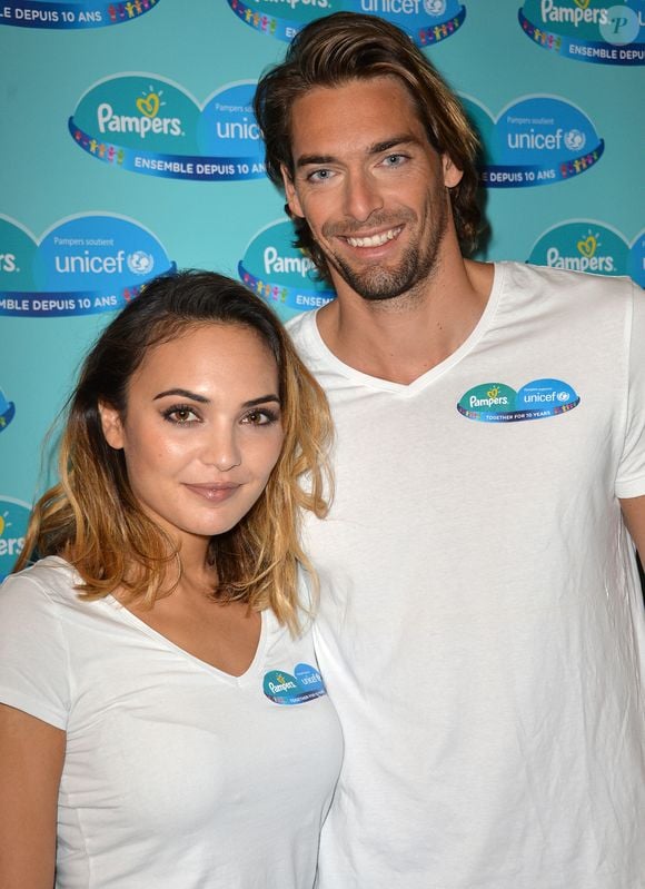 Camille Lacourt et sa femme Valérie Bègue sont les parrain et marraine du 10ème anniversaire du partenariat entre Pampers et l'Unicef pour le vaccin des enfants contre le tétanos. Paris, le 13 novembre 2015. VEEREN / BESTIMAGE