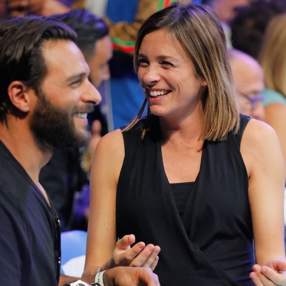 Maxim Nucci (Yodelice)  et sa compagne enceinte Isabelle Ithurburu assistent au match de boxe de Tony Yoka au palais des sports de Paris, le 23 juin 2018 © Veeren-CVS/Bestimage