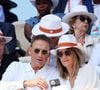 Pourtant, le mariage des deux tourtereaux aurait bien pu ne jamais se dérouler...
Julien Courbet et sa femme Catherine - Célébrités dans les tribunes des Internationaux de France de tennis de Roland Garros 2023 le 6 juin 2023. © Jacovides-Moreau/Bestimage
