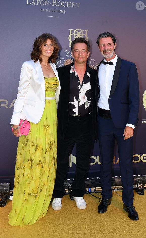 David Hallyday et sa femme Alexandra Pastor, Patrick Mouratoglou - 9ème gala étoilé Patrick Mouratoglou (coach légendaire de S. Williams) au profit de la Fondation Champ'seed à la Mouratoglou Academy afin de soutenir les jeunes espoirs du tennis mondial à Biot le 18 juin 2023. Un dîner était organisé autour de l'iconique piscine en forme de raquette, suivi d'une vente aux enchères avec des lots prestigieux dont une heure d'entrainement en compagnie de M. Tyson. © Agence / Bestimage