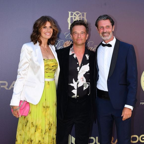 David Hallyday et sa femme Alexandra Pastor, Patrick Mouratoglou - 9ème gala étoilé Patrick Mouratoglou (coach légendaire de S. Williams) au profit de la Fondation Champ'seed à la Mouratoglou Academy afin de soutenir les jeunes espoirs du tennis mondial à Biot le 18 juin 2023. Un dîner était organisé autour de l'iconique piscine en forme de raquette, suivi d'une vente aux enchères avec des lots prestigieux dont une heure d'entrainement en compagnie de M. Tyson. © Agence / Bestimage