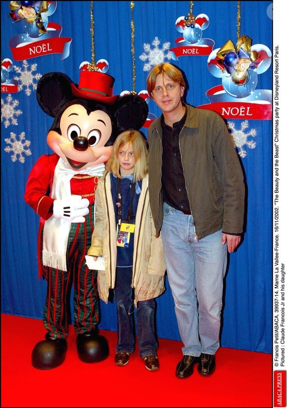 Claude François Jr et sa fille à Disneyland Paris en 2002. Petit Francis/ABACA