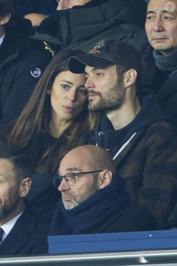 Exclusif - Louis Sarkozy et sa femme Natali Husic en tribunes du match de Ligue 1 Uber Eats "PSG contre Reims" (1-1) au Parc des Princes, le 29 janvier 2023.

Photo : Agence / Bestimage
