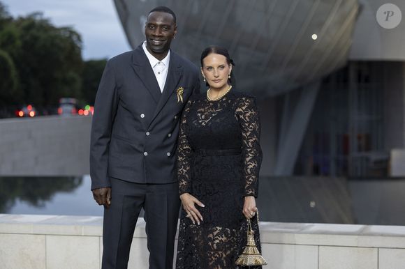 Omar Sy et sa Helene (bijoux Tasaki) - Photocall du dîner "Prelude pour les JO" à la Fondation Vuitton à Paris, France, le 25 juillet 2024. © Olivier Borde/Bestimage