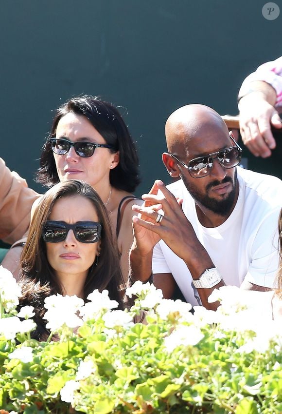 Nicolas Anelka et sa femme Barbara - La France a remporté la demi-finale de la Coupe Davis face à la République tchèque à Roland Garros à Paris, le 13 septembre 2014. Jo-Wilfried Tsonga et Richard Gasquet ont gagné le double et obtiennent ainsi leur place pour la finale.
JACOVIDES-MOREAU / BESTIMAGE
