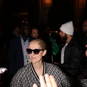Paris, FRANCE  - Celine Dion in full Dior creates a crowd movement as she exits through the roof of her car leaving her hotel in Paris followed by her fans



Pictured: Celine Dion