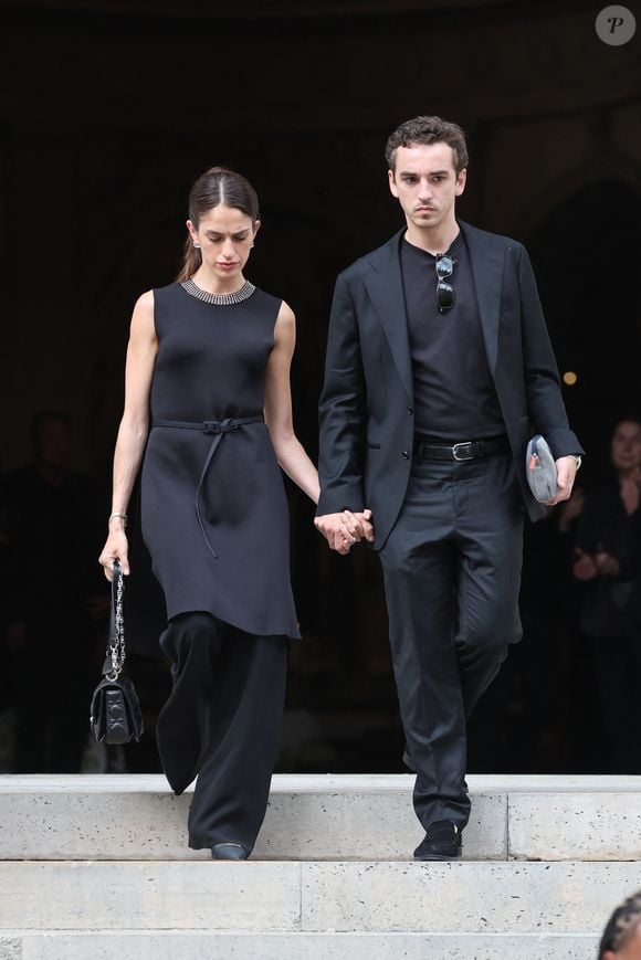Gaston Ardisson et sa compagne - Sorties des obsèques de Thierry Ardisson en l’église Saint-Roch de Paris, France, le 17 juillet 2025. © Clovis-Jacovides/Bestimage
