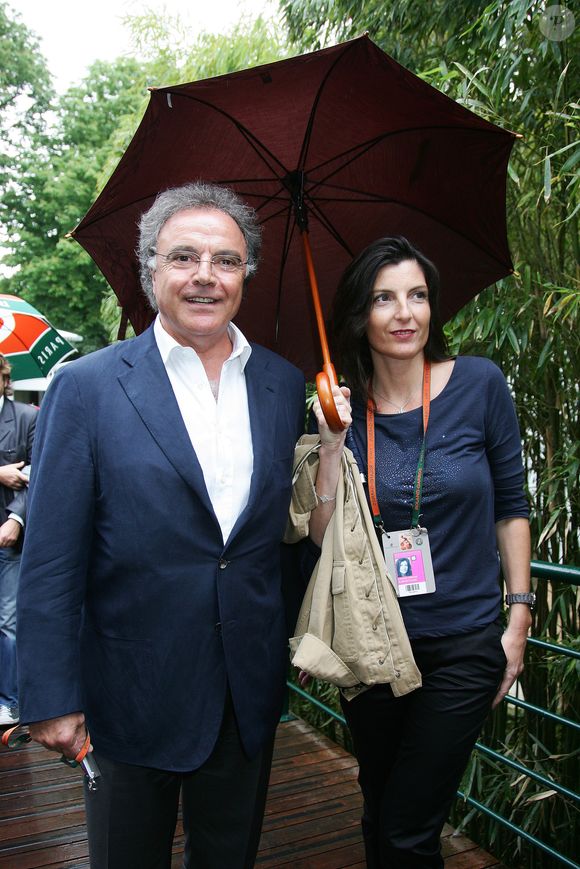Archives - Alain Afflelou et sa compagne Christine à Roland Garros le 27 mai 2010.