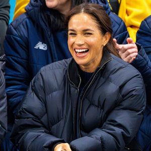 Une sorte de télé réalité dans laquelle elle dévoile sa vie derrière les fourneaux 

Le prince Harry, duc de Sussex et Meghan Markle, duchesse de Sussex, assistent à un match de basketball en fauteuil lors des "Invictus Games Vancouver Whistler 2025" à Vancouver, le 9 février 2025. Backgrid USA / Bestimage