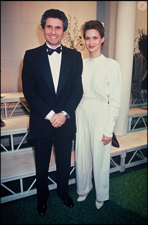 Claude Lelouch et sa femme Marie-Sophie L. et Jean-Paul Belmondo à Paris en 1988. ©Bestimage