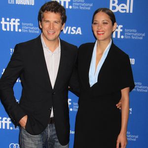 Guillaume Canet et Marion Cotillard (habillee en Dior Haute Couture) - Photocall du film "Blood Ties" au festival du Film de Toronto le 10 septembre 2013. ©Bestimage