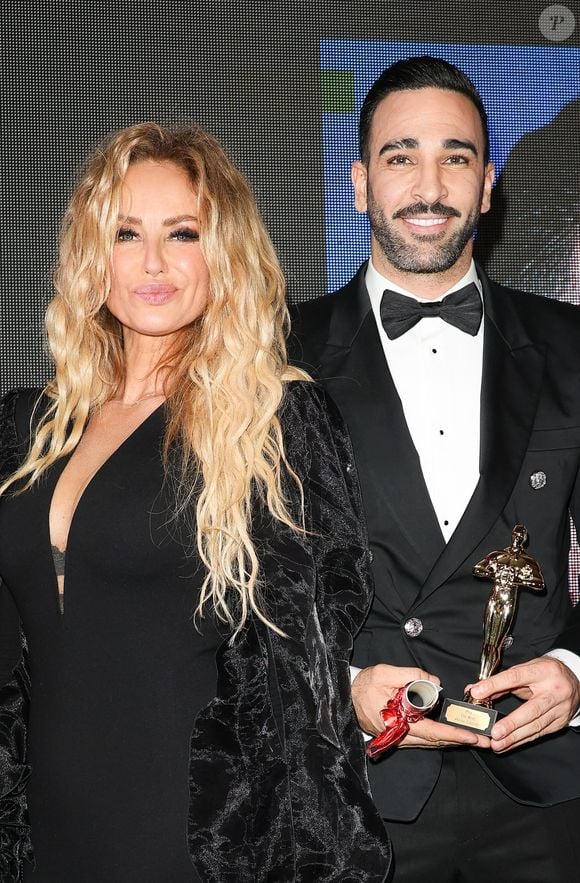 "On doit répéter demain matin, ça va être rock’n’roll", nous explique-t-elle. 

Adriana Karembeu et Adil Rami - 46ème édition du Gala "Best Awards" à l'hôtel Georges V à Paris le 11 décembre 2023.© Coadic Guirec / Bestimage