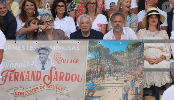 Semi-exclusif - Michel Sardou et sa femme Anne-Marie Périer, Romain Sardou et sa compagne Kym Thiriot enceinte - Michel Sardou rend hommage à son père en famille lors du premier trophée de pétanque "Fernand Sardou" à Bormes-les-Mimosas le 29 mai 2026. Le célèbre chanteur est venu en famille avec sa femme, son fils Romain avec son fils de deux ans et demi et de sa compagne enceinte de son deuxième enfant.
La première édition du Trophée Fernand Sardou est organisée du 29 au 31 mai au coeur du village de Bormes les Mimosas. Une initiative portée par Michel et son fils Romain, pour rendre hommage à leur illustre parent Fernand Sardou au travers d'un tournoi de pétanque.
En lien avec la municipalité et l'Amicale Bouliste Borméenne (ABB), un premier Trophée Fernand Sardou sera organisé avec deux grands temps forts : Le vendredi, dès 18h, un tournoi d'exhibition sera proposé et verra s'affronter 16 triplettes. Puis un concours fédéral à pétanque sera organisé le weekend et ouvert à tous les amateurs. 128 équipes seront réparties sur les sites les plus emblématiques du village, à savoir au boulodrome de la place Saint-François, mais aussi au parc Cigalou, sur le site du château et à l'ancien stade. © Franz Chavaroche/Bestimage