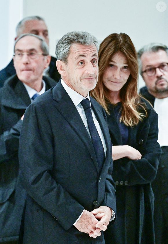 Nicolas Sarkozy et sa femme Carla Bruni - Nicolas Sarkozy condamné à 5 ans de prison à l'issue du procès de l'affaire du financement libyen au tribunal correctionnel de Paris, le 25 septembre 2025. L'ancien chef de l'Etat était accompagné de sa femme, C.Bruni. Nicolas Sarkozy, jugé coupable d’association de malfaiteurs, sera prochainement convoqué en vue de lui signifier la date de son incarcération. 
© Christian Liewig / Bestimage