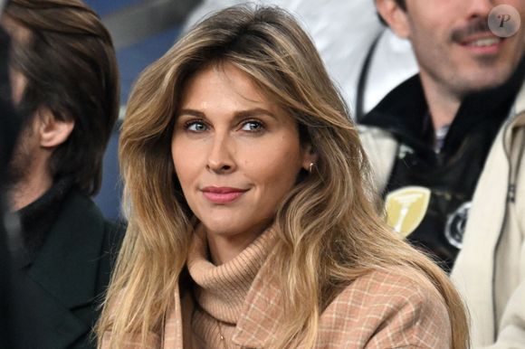 Ophélie Meunier - Célébrités dans les tribunes du match de 8ème de finale aller de la Ligue Des Champions 2025-2026 (LDC) "PSG - Chelsea (5-2)" au Parc des Princes à Paris le 11 mars 2026. © Lionel Urman/PsnewZ/Bestimage