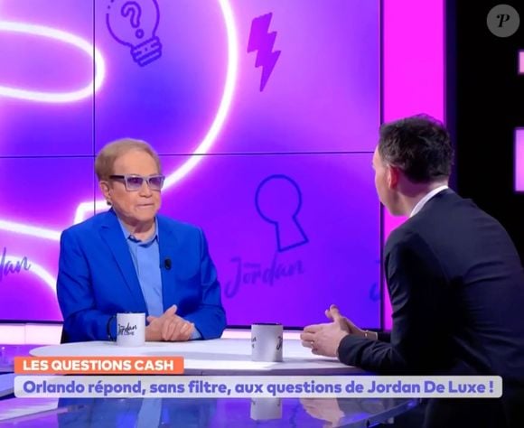 Jordan De Luxe face à Orlando dit Bruno Gigliotti sur le plateau de Chez Jordan (Capture d'écran C8 : diffusion du 26 février 2025)