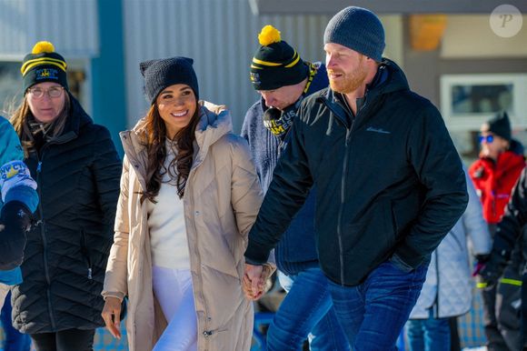 Le prince Harry, duc de Sussex et Meghan Markle, duchesse de Sussex, en visite au camp d'entrainement des athlètes des Invictus Games 2024 à Whistler en Colombie Britannique, le 14 février 2024. Backgrid USA / Bestimage