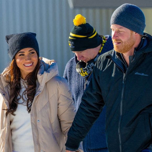 Le prince Harry, duc de Sussex et Meghan Markle, duchesse de Sussex, en visite au camp d'entrainement des athlètes des Invictus Games 2024 à Whistler en Colombie Britannique, le 14 février 2024. Backgrid USA / Bestimage