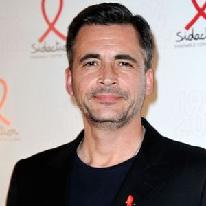 Olivier Minne posant lors d'un photocall pour le lancement du Sidaction 2014 et du 'Sidaction 20e anniversaire' qui s'est tenu au Musée du quai Branly à Paris, France, le 10 mars 2014. Photo par Aurore Marechal/ABACAPRESS.COM