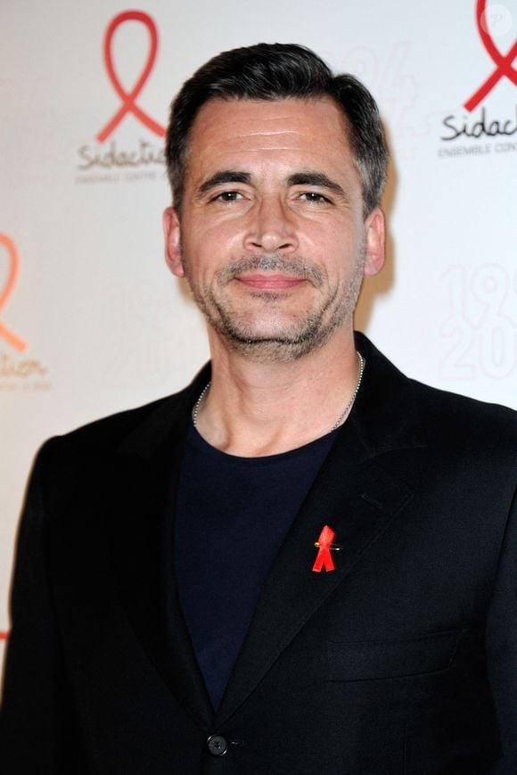 Olivier Minne posant lors d'un photocall pour le lancement du Sidaction 2014 et du 'Sidaction 20e anniversaire' qui s'est tenu au Musée du quai Branly à Paris, France, le 10 mars 2014. Photo par Aurore Marechal/ABACAPRESS.COM