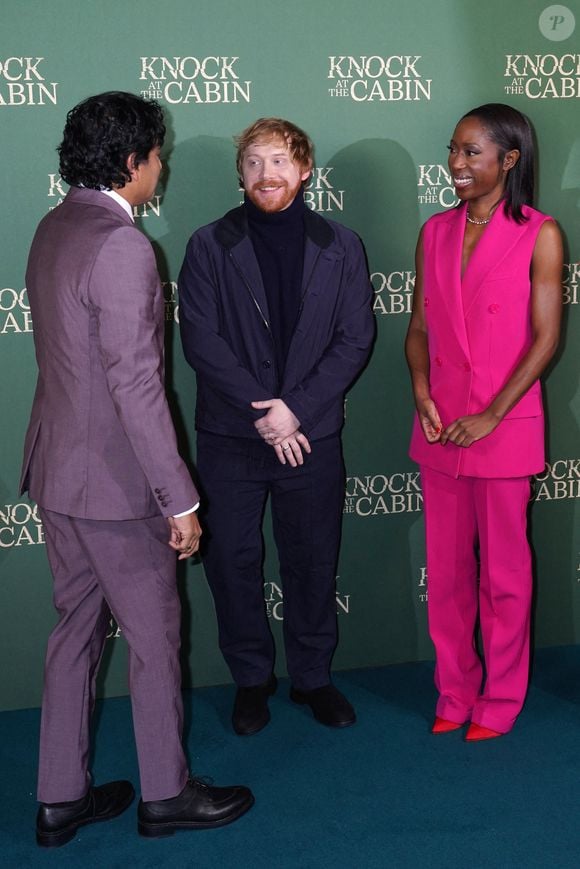 De gauche à droite, M. Night Shyamalan, Rupert Grint et Nikki Amuka-Bird arrivant à la projection spéciale de "Knock at the Cabin", au Vue West End à Londres, le mercredi 25 janvier 2023.