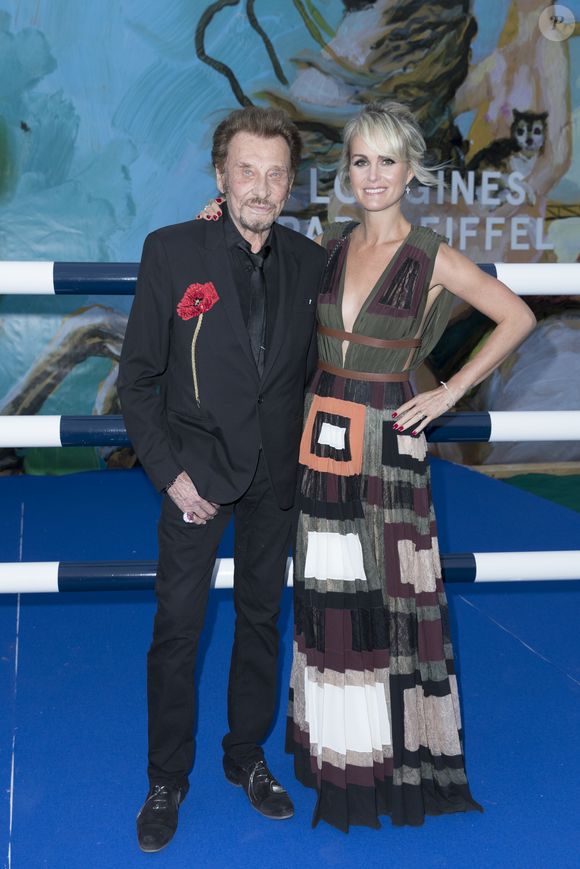 Exclusif - Johnny Hallyday et sa femme Laeticia Hallyday - Soirée au profit de l'Association "La Bonne étoile" de Laeticia Hallyday lors du 3ème Longines Paris Eiffel Jumping à la plaine de Jeux de Bagatelle à Paris le 1er juillet 2016 dans le Pavillon Eiffel du Longines Paris Eiffel Jumping décoré par Luxury Living. © Olivier Borde / Veeren / Bestimage