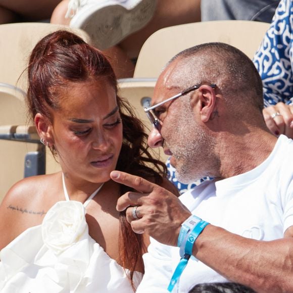 C’est donc dans ce cadre privilégié qu’Amel Bent et son époux Patrick Antonelli, ancien gérant d’auto-école, ont décidé d’élever leurs trois enfants...

Amel Bent et son mari Patrick Antonelli dans les tribunes lors des Internationaux de France de Tennis de Roland Garros 2023. Paris, le 10 juin 2023. © Jacovides-Moreau / Bestimage