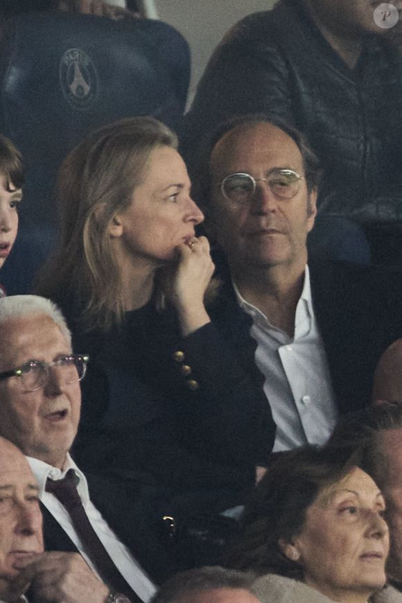 Xavier Niel et sa compagne Delphine Arnault - Célébrités dans les tribunes de la demi-finale retour de Ligue des champions entre le PSG face au Borussia Dortmund (0-1) au Parc des Princes à Paris le 7 mai 2024. © Cyril Moreau/Bestimage