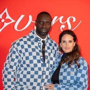Omar Sy et Helene Sy assistent au défilé Louis Vuitton Menswear Fall/Winter 2024-2025 dans le cadre de la semaine de la mode à Paris, France, le 16 janvier 2024. Photo par Aurore Marechal/ABACAPRESS.COM