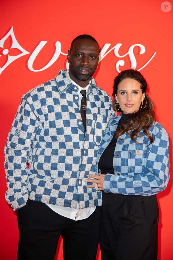 Omar Sy et Helene Sy assistent au défilé Louis Vuitton Menswear Fall/Winter 2024-2025 dans le cadre de la semaine de la mode à Paris, France, le 16 janvier 2024. Photo par Aurore Marechal/ABACAPRESS.COM