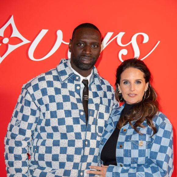 Omar Sy et Helene Sy assistent au défilé Louis Vuitton Menswear Fall/Winter 2024-2025 dans le cadre de la semaine de la mode à Paris, France, le 16 janvier 2024. Photo par Aurore Marechal/ABACAPRESS.COM